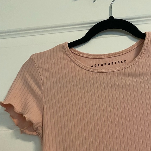 Arie pink shirt with ruffled endings on both arms and bottom. Good quality. - Picture 5 of 5